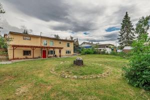 a large yard with a house and a building at 2 Mins from Airport 1 BDR with Large Backyard in Anchorage