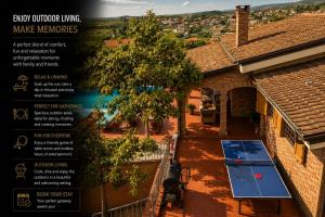an overhead view of a house with a table in the courtyard at Villa Pool & Sun Durrës in Durrës