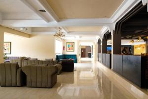 a lobby with couches and a bar at HAMILTON Agadir in Agadir