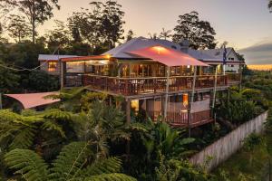 a house in the middle of a forest at Tamborine Mountain Bed and Breakfast in Mount Tamborine