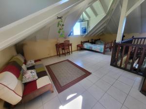 an overhead view of a living room with a couch at KAZ A CE TI MOUN LA, à Deshaies in Deshaies