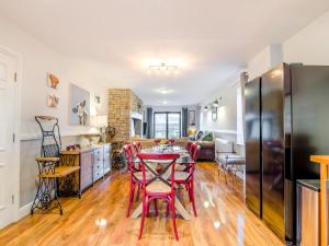 a kitchen and living room with a table and chairs at Cromwell House - Uk42450 in Winforton