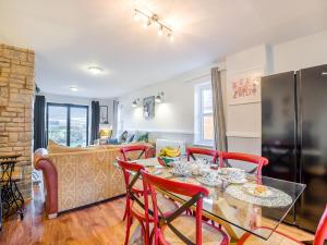 a dining room and living room with a table and chairs at Cromwell House - Uk42450 in Winforton