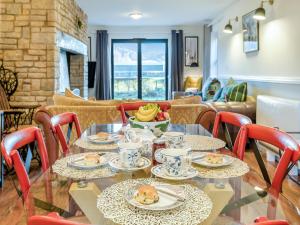 a dining room with tables and chairs with food on them at Cromwell House - Uk42450 in Winforton +22 photos