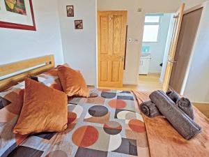 a bedroom with a bed with pillows on it at Dinky Daze - Ukc7071 in Brundall