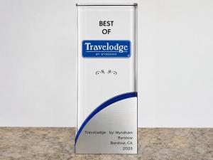 a sign for the best of travelodge on a wall at Travelodge by Wyndham Barstow in Barstow