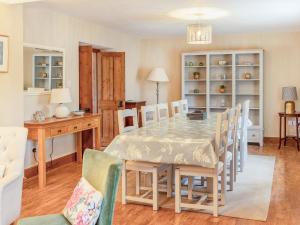 a dining room with a table and chairs at Lower Barrowfield Farm in Beaminster