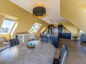 a kitchen and dining room with a table and chairs at Murlin in Collieston