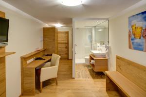 Sjónvarps- og/eða afþreyingartæki á Hotel Leimer Bräu