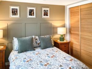 a bedroom with a bed with two pillows at Seaspray in Buckie +9 photos