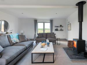 a living room with a couch and a fireplace at The Foundary - Uk36319 in Whitchurch
