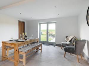 a dining room with a wooden table and chairs at The Foundary - Uk36319 in Whitchurch +10 photos