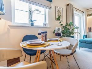 a dining room with a table and chairs at The Wharf in Warwick