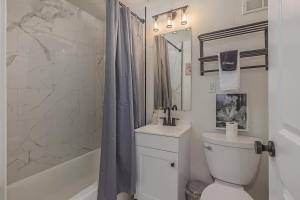 a bathroom with a toilet and a shower at Downtown 1 Bedroom Flat with Views in Anchorage
