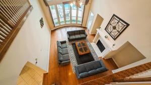 an overhead view of a living room with chairs and a table at Elegant, comfy, a retreat with Pool in Garland