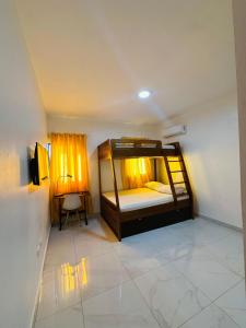a bedroom with a bunk bed in a room at Luma Residence in San Felipe de Puerto Plata