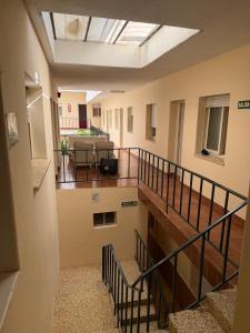 an empty room with stairs in a building at Malibu in Termas de Río Hondo