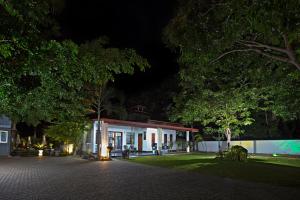 a house at night with a pavilion at Wild Le Green in Udawalawe +25 photos