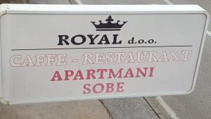a white sign for a cafe registration apparatusagentote at Royal Apartments in Neum