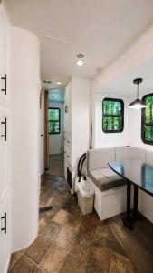 a living room with a table and a couch at 2-bedroom Camper Trailer Cottage #3 in Dillon