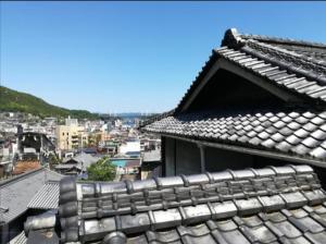 a roof of a building with a view of a city at s19 tea celemony villa in Onomichi
