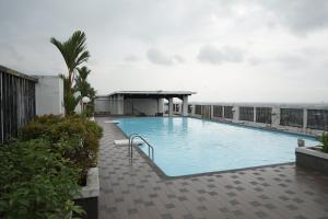 a large swimming pool on top of a building at Skyview Apartment by Grand Sky Hotel in Sunggal