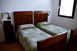 Ένα ή περισσότερα κρεβάτια σε δωμάτιο στο Agriturismo Sartori Terenzio