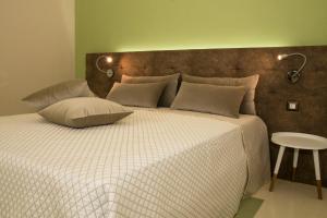 Un pat sau paturi într-o cameră la Stanze Orsini