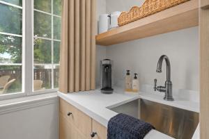 a kitchen with a sink and a window at Bella Notte by the Beach in Santa Cruz +265 photos