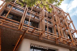 a building with a wooden scaffolding on it at The Cut Hotel in Medellín