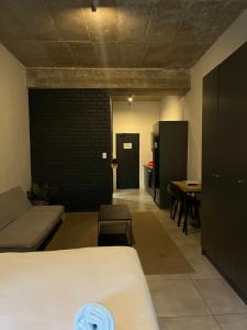 a room with a bed and a table and a couch at Sandton CBD apartment in Johannesburg