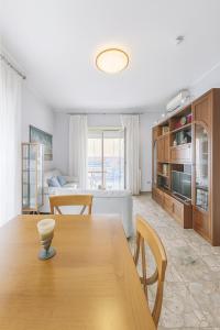 a kitchen and dining room with a table and chairs at Al Centro - Gaeta in Gaeta