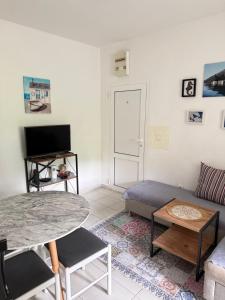 a living room with a couch and a table at Apartman Dunjićeva in Kotor