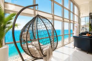 a room with a beach view from a building at Penthouse Panorama Luxury Sea View Premium Stay in Batumi in Batumi +117 photos