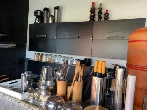 a counter top with a bunch of kitchen utensils at BACKHOUSE Vieiralves - Manaus in Manaus +7 photos