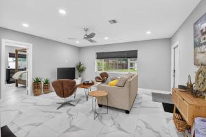 a living room with a couch and a table at Marina Row 4 Beach Shops in Delray Beach
