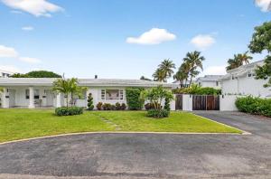 a large white house with a driveway at Marina Row 4 Beach Shops in Delray Beach