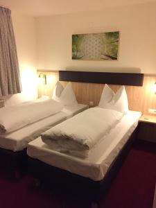 Katil atau katil-katil dalam bilik di Hotel Restaurant Rössle