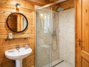 a bathroom with a sink and a shower at Eco house in Szack