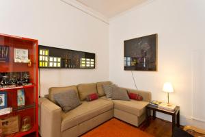 a living room with a couch and a table at Hostel Alegria in Porto