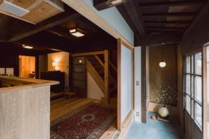 an open room with a staircase in a house at RITA Okawa Hanzakai in Wakatsu +52 photos