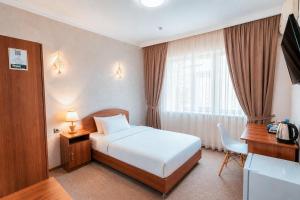 a hotel room with a bed and a window at Asson Hotel Termez in Termiz +29 photos