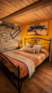 a bedroom with a large bed in a room at Rustico Verginate in Bellano