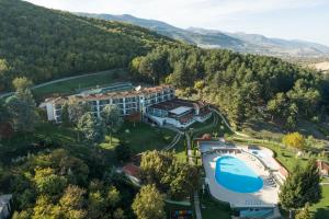 an aerial view of a resort with a swimming pool at Hotel Makpetrol Struga in Struga
