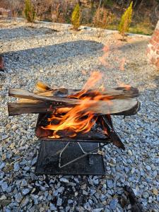 a fire on a grill on the rocks at 상록수 sangroksu in Boeun