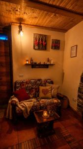 a living room with a couch and a table at Rustico Verginate in Bellano
