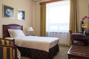 Postel nebo postele na pokoji v ubytování Grand Hotel Viljandi