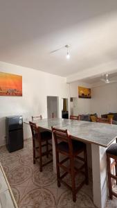 a living room with a large table and chairs at the velvet nest in Watamu