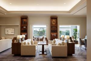 a living room with couches and a table at Grand Nikko Tokyo Daiba in Tokyo
