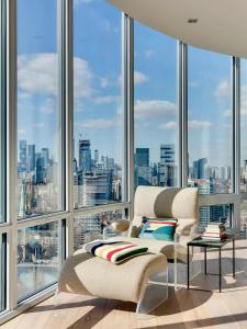 a living room with a view of a city at Luxurious Panoramic Skyline Penthouse 2Bedrooms Suites CN Toronto Downtown in Toronto
